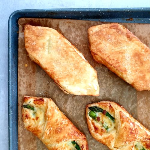 Overhead image showing 2 of 4 pastries flipped upside down to show a golden and crisp underside. 